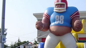 Football Obstacle Course - Challenge the 52' of squeeze plays, tackle dummies, tire runs and a final climb ending with a giant slide on this obstacle course.