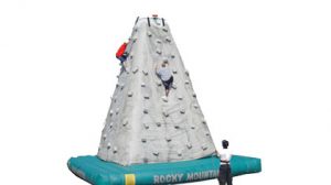 Rock Wall - Our mobile rock wall is 28 feet tall and offers the ability for three climbers to ascend simultaneously. It features an automatic belay system that automatically draws up the cable to keep the climbers safe.