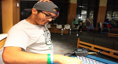 Jose running the sound board at Underground Cafe